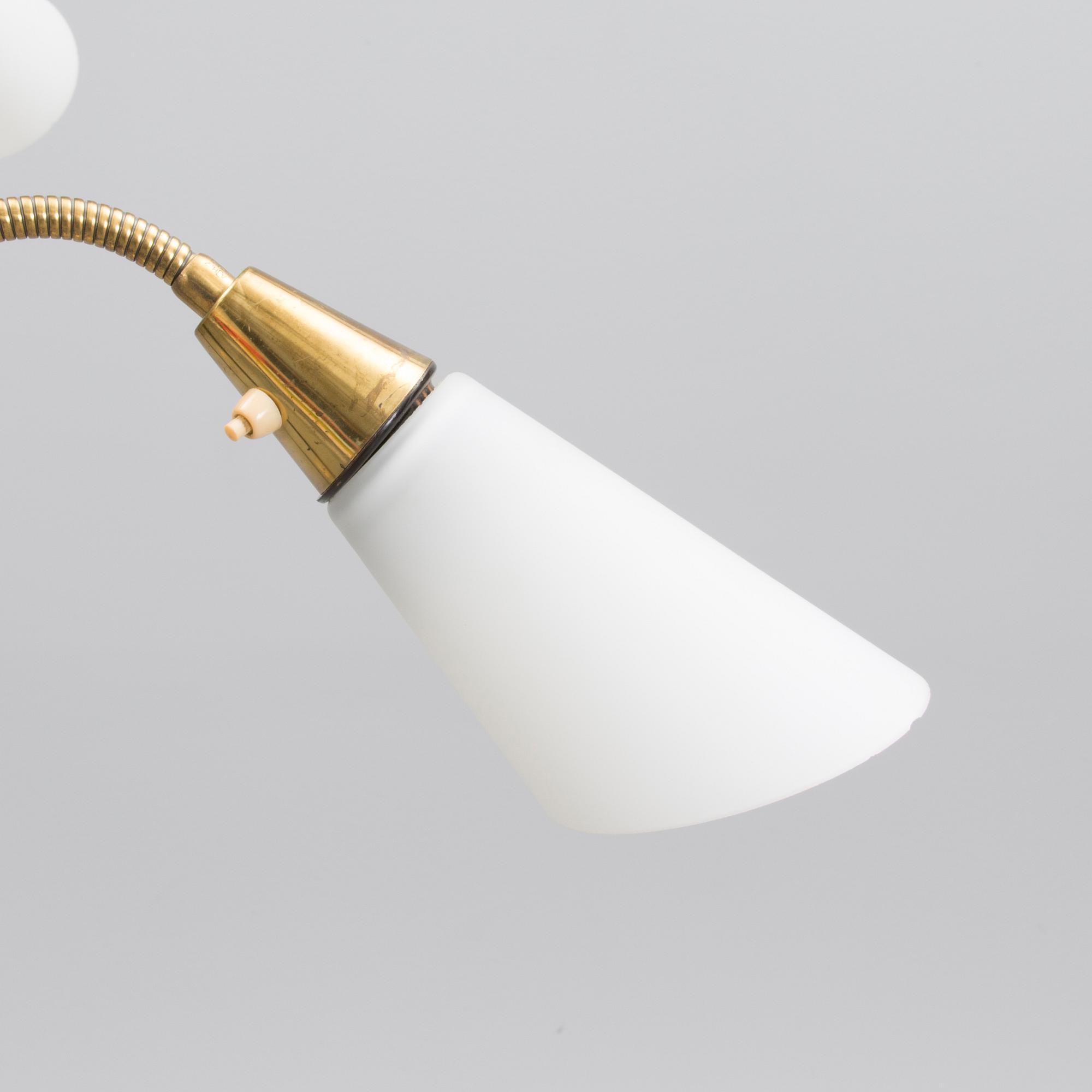 A mid 20th century floor lamp, marked AJH.7.