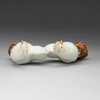 A pair of white and brown glazed figures of roosters, late Qing dynasty,