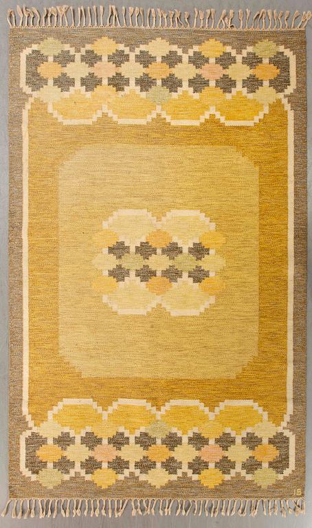 A Swedish flat weave carpet signed Ingegerd Silow 282x196 cm.