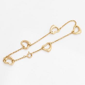 Tiffany & Co, Elsa Peretti, an 18K gold 'Open Heart' bracelet.