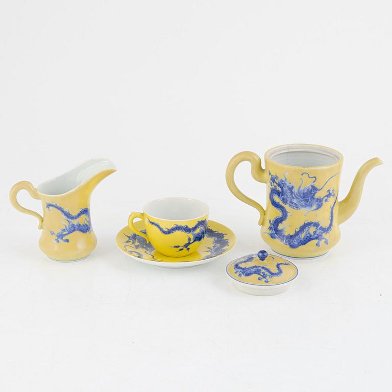 A Japanese teapot, teacup with saucer, and milk jug, porcelain, signed, 20th century.