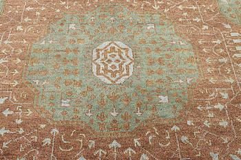 An oriental carpet with Mamluk design, c. 358 x 281 cm.