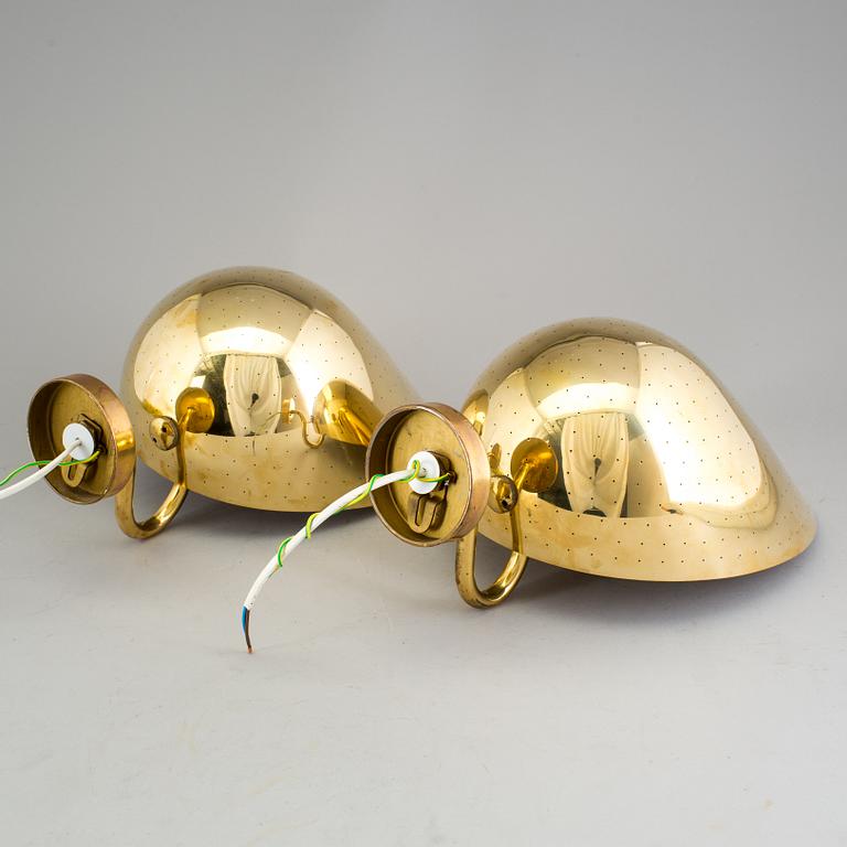 CARL-AXEL ACKING, a pair of brass wall lights.