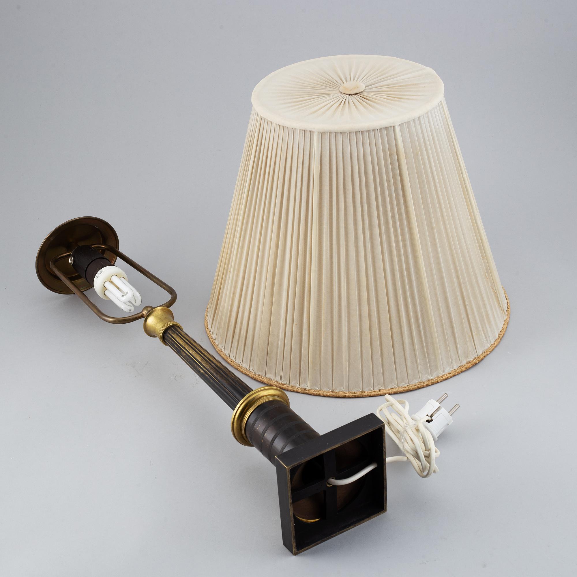 An empire style table lamp from the first half of the 20th century.