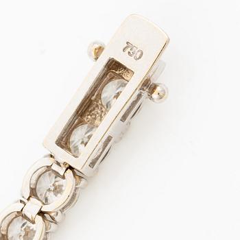 A tennis bracelet in 18K white gold set with round brilliant-cut diamonds total ca 11.50 ct, accompanied by GIA dossier.