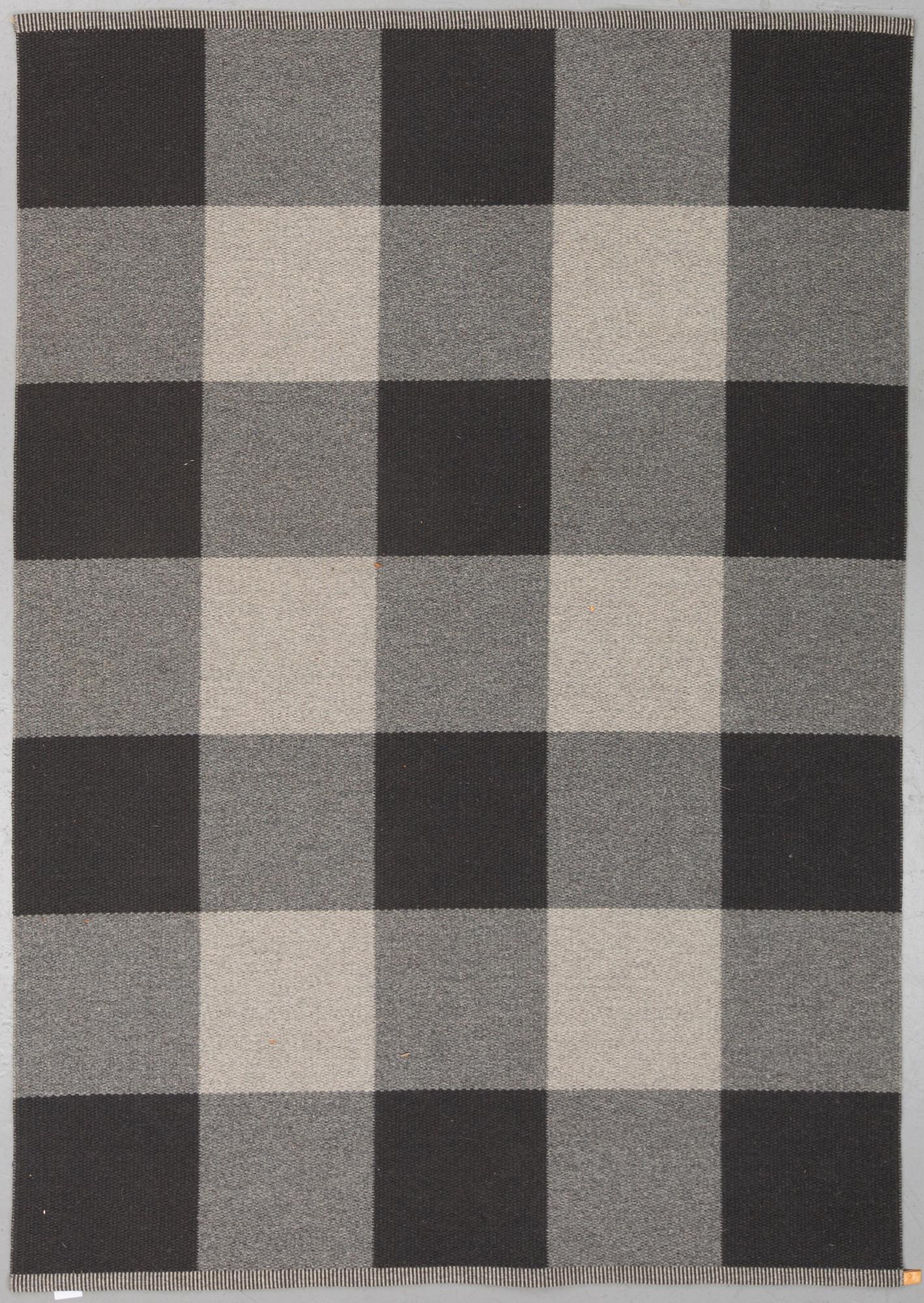 A mashine woven carpet, "Checkerboard", designed by Gunilla Lagerhem-Ullberg, Kasthall, around 246 x 163 cm.