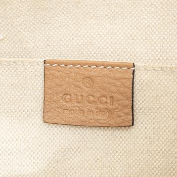 Gucci, a backpack.