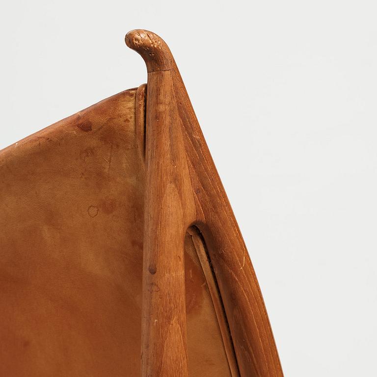 Finn Juhl, a teak and natural brown leather "Chieftain Chair" by Niels Vodder, 1950-60's.