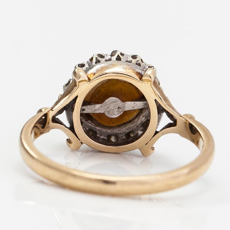 A 9K gold ring with a cultured pearl and diamonds ca. 0.035 ct in total. United Kingdom.