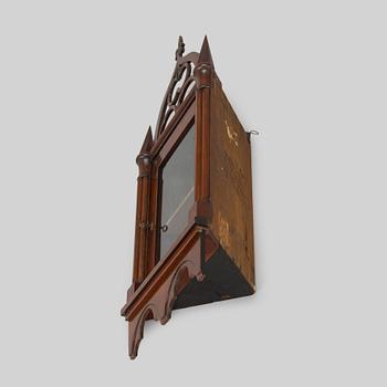 A mid-19th-century wall cabinet.