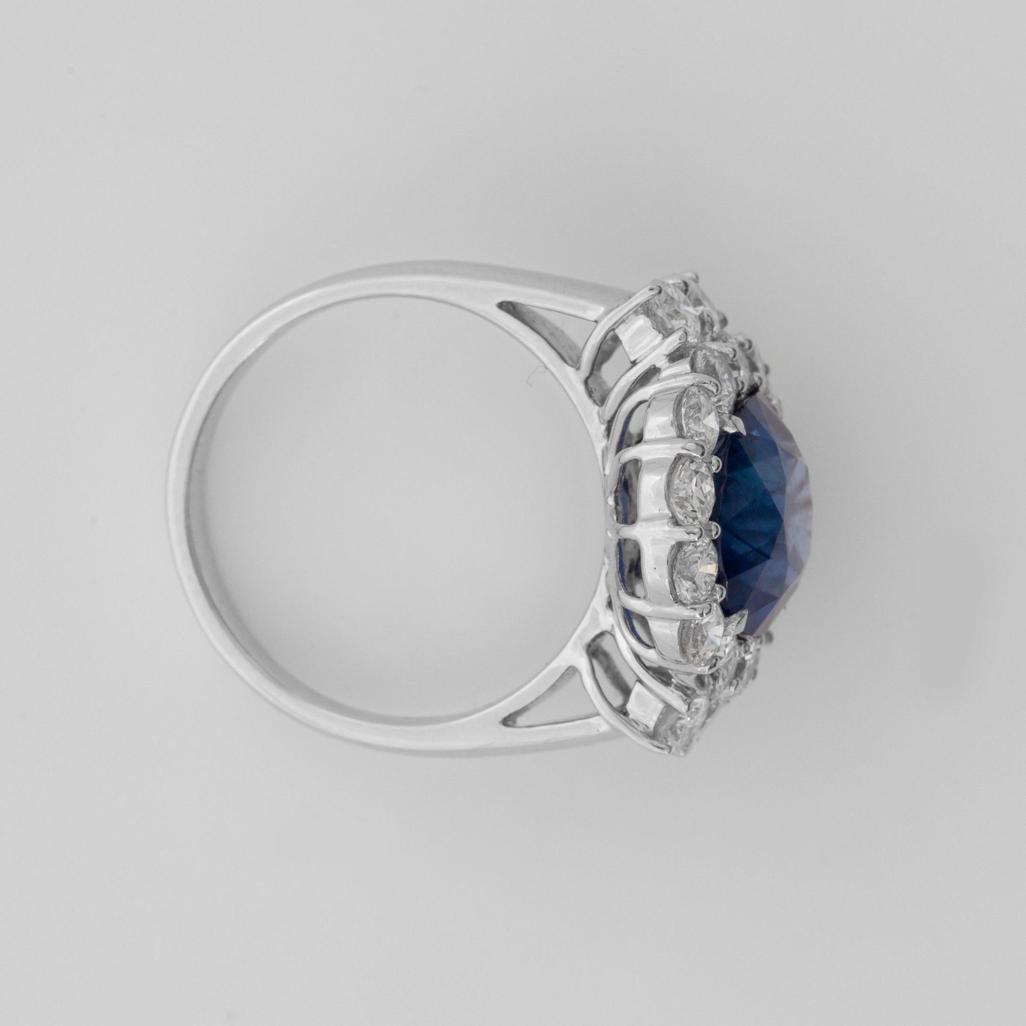 A 5.74 cts sapphire and diamond ring. Total carat weight 1.70 cts.