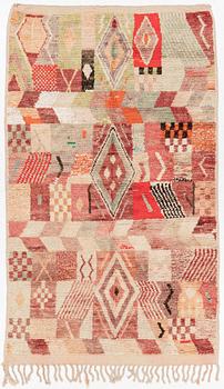 A Moroccan crpet, c. 240 (+7+8 cm flat weave) x 151 cm.
