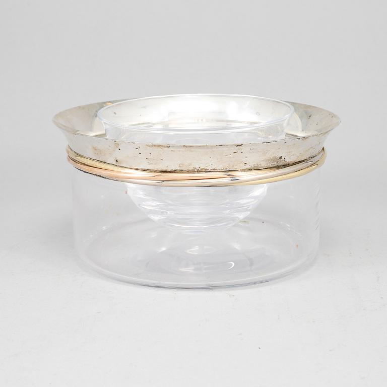 LES MUST DE CARTIER, a sterling silver and glass caviar bowl, Paris, France.