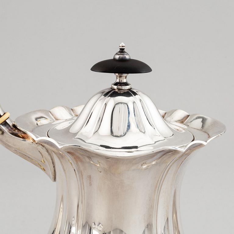 A swedish parcel-gilt coffee pot, creamer and suga bowl.