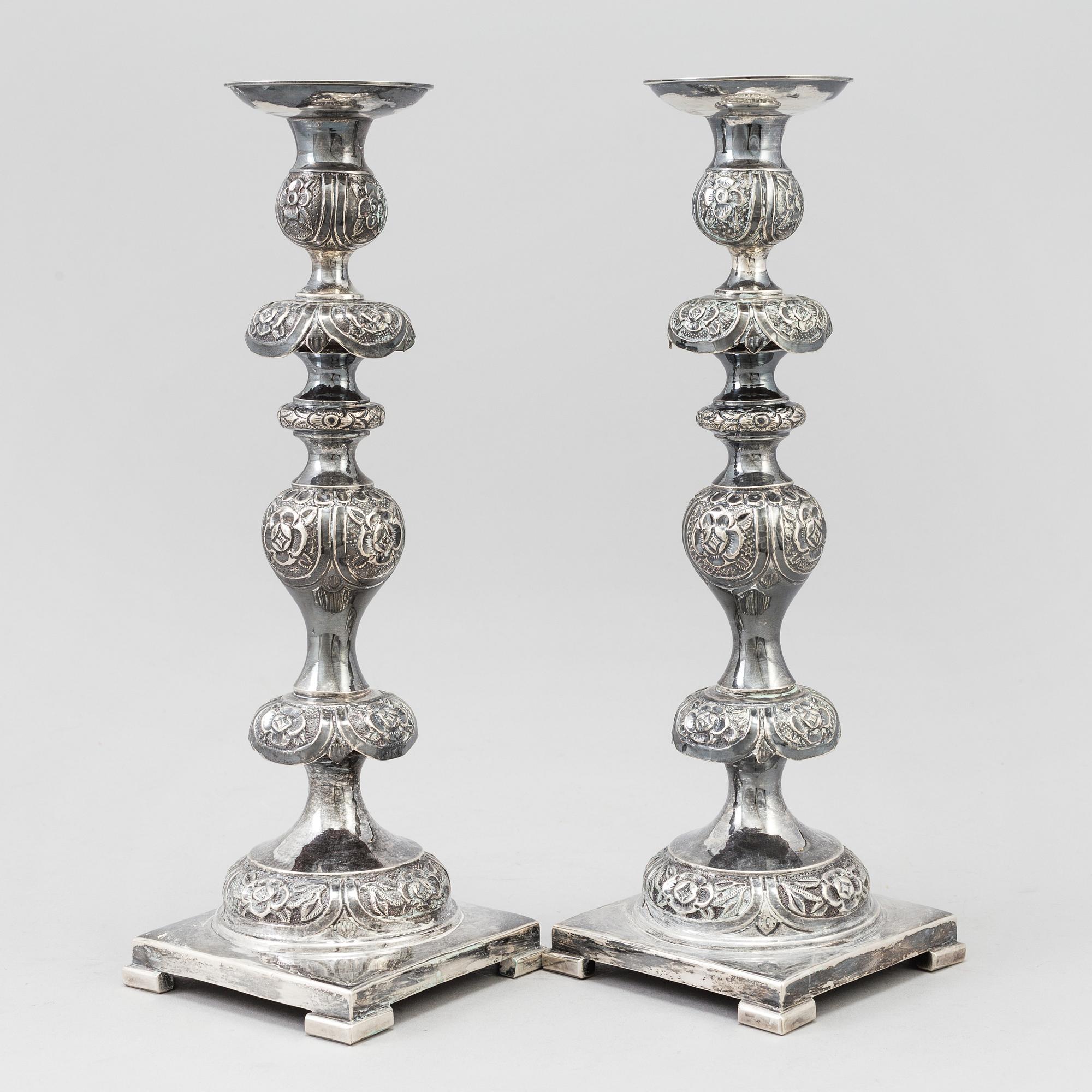 A pair of silver Sabbath candlesticks, Maker M. Sztern, Warsaw, Poland. Assayer Josef Sosnkowski, 1864. Weight 833 g.