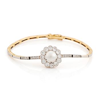 383. A gold and platinum bracelet with a bouton pearl and set with old- and eight-cut diamonds.