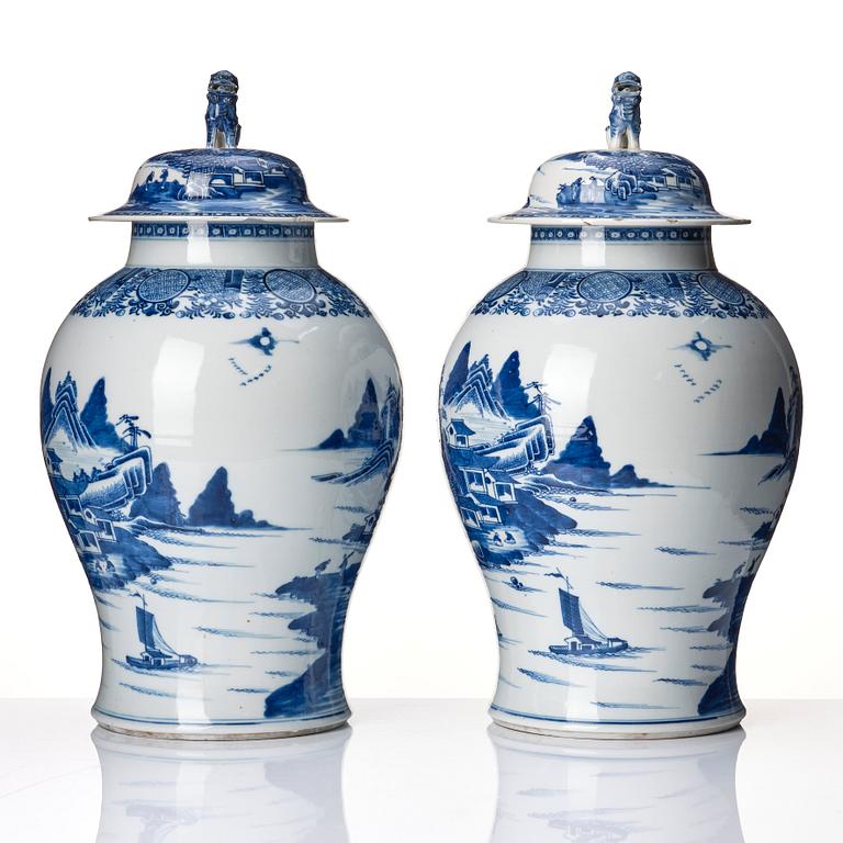 A pair of blue and white Chinese porcelain jars with covers. Qing dynasty, Qianlong (1736-95).