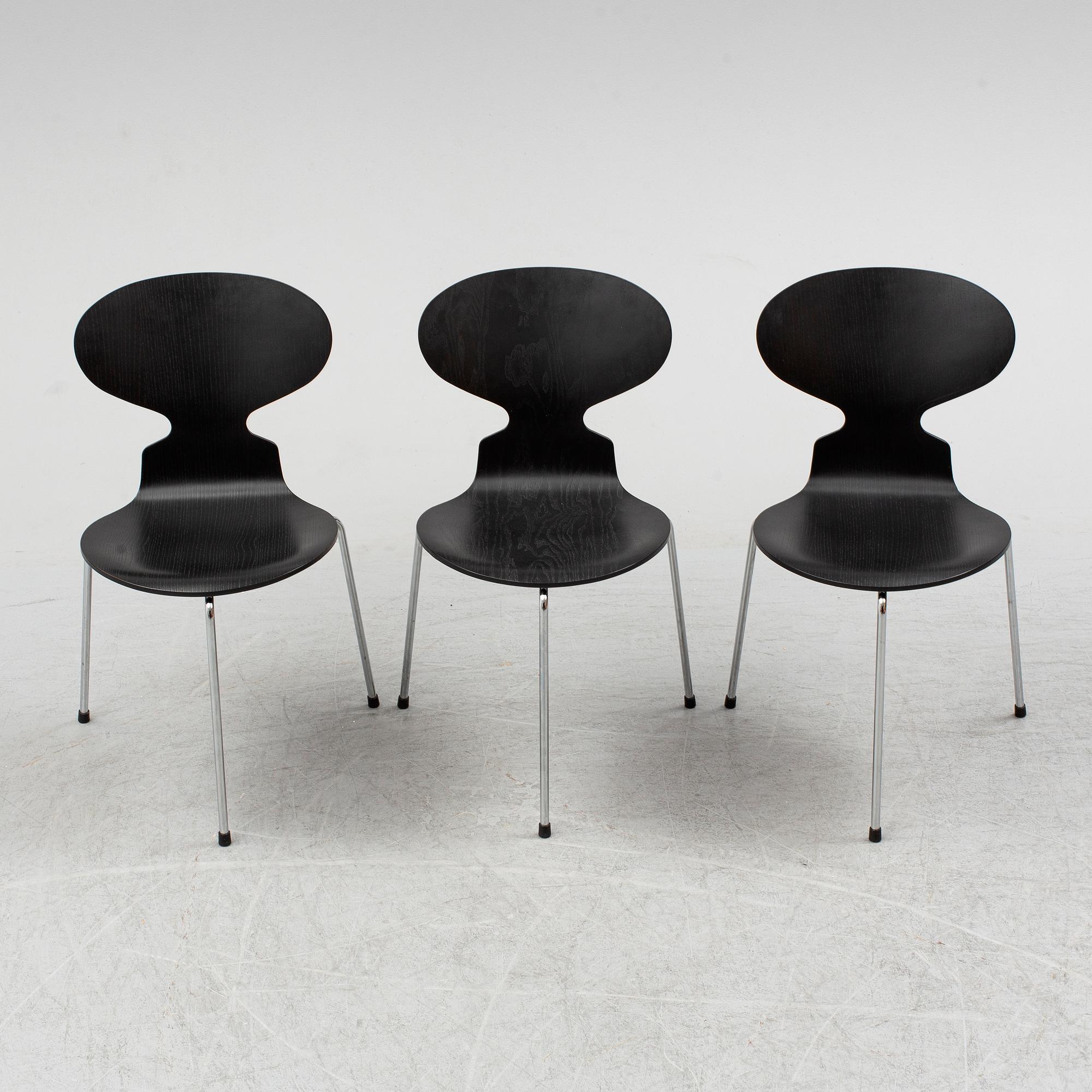 An Arne Jacobsen "Centenary Package" comprising three "Ant Chairs" and an eggshaped table, Fritz Hansen, Denmark.