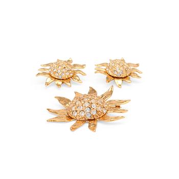 463. YVES SAINT LAURENT, a pair of gold colored and rhinestone embellished clip earrings and brooch.