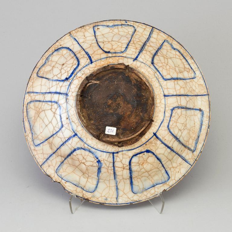 A blue and white persian dish, Qajar dynasty, possibly "Kubachi-ware",