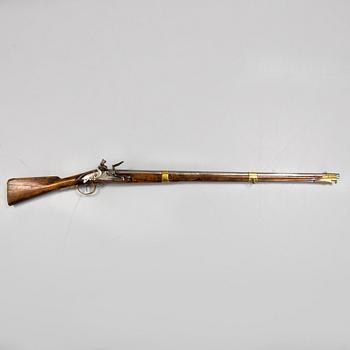 A late 18th century flintlock rifle.