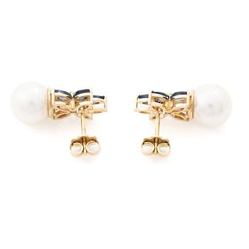 18K gold earrings with cultured Akoya pearls and navette-cut sapphires.