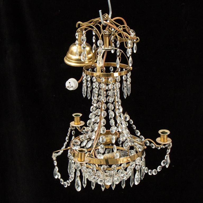 A small Swedish 20th century empire style chandelier for three candles.