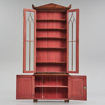 A Swedish faux-boix neo-gothic book cabinet, ca 1830.
