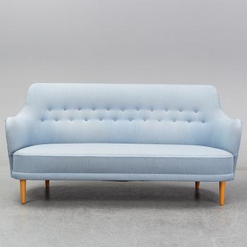 A 'Samsas' sofa and easy chair by Carl Malmsten dared 1985.