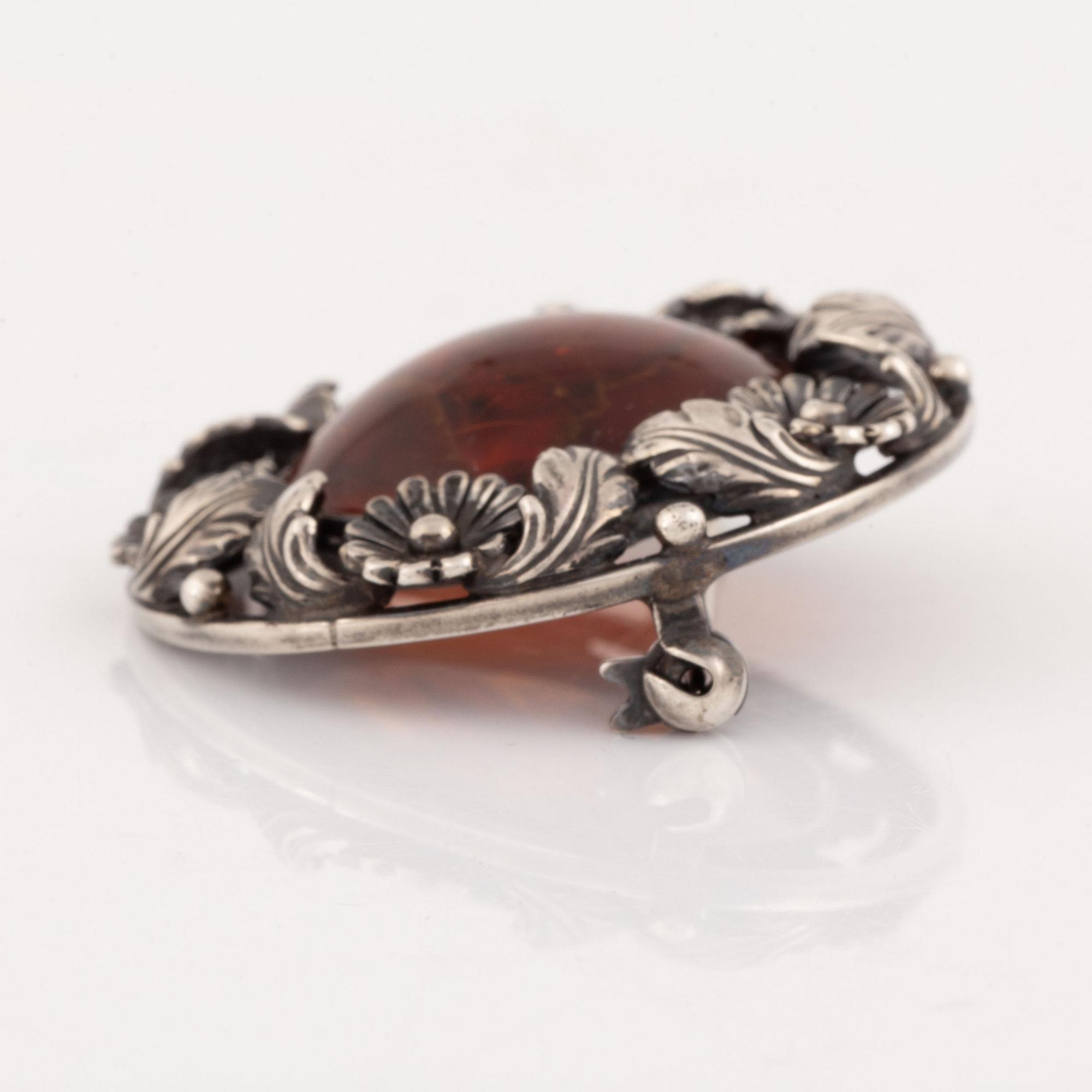 An NE From silver and amber brooch.
