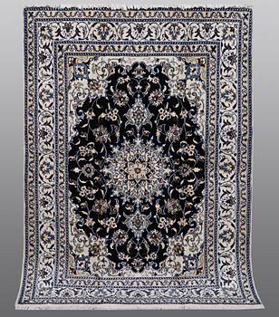 A carpet, Nain, part silk, ca 212 x 153 cm.