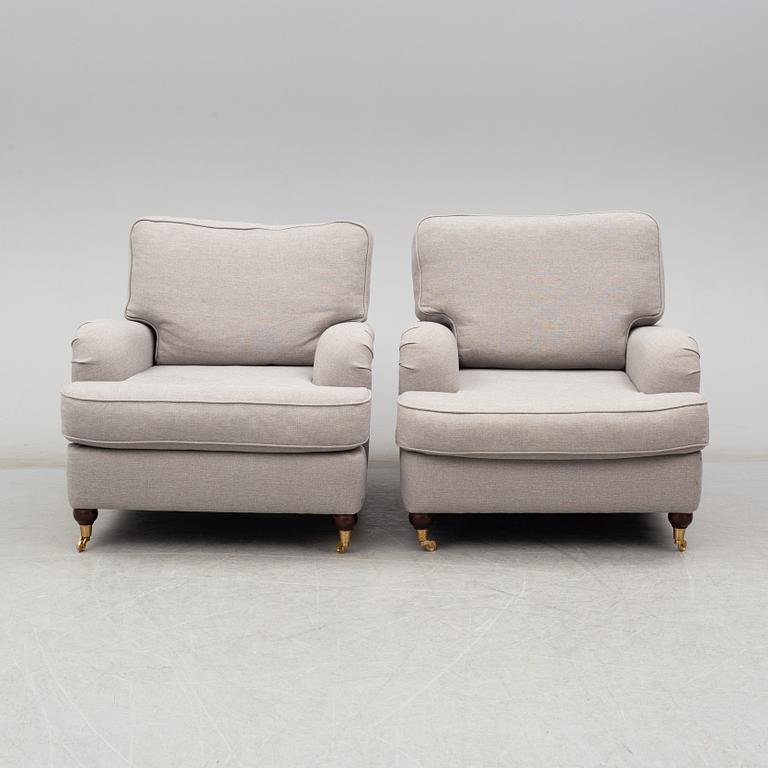 A 21st Century pair of Howard lounge chairs.