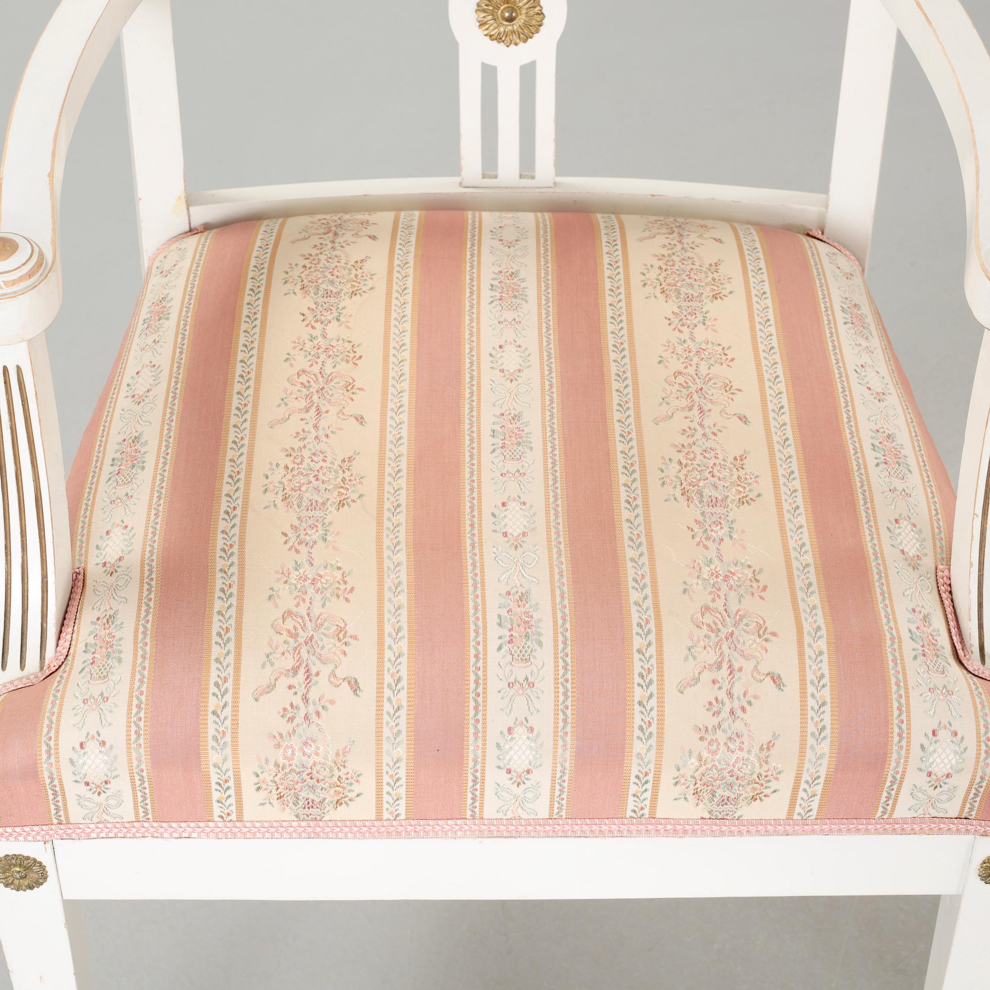 Two gustavian style armchairs and three chairs, first half of the 20th century.