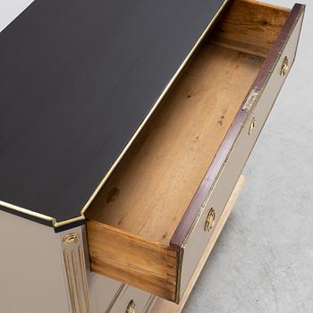 A painted Gustavian style chest of drawers from around the year 1900.