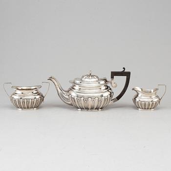 A silver teapot, creamer and sugar bowl, S Glass, Birmingham 1908.