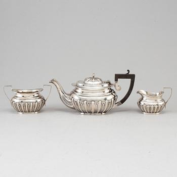 A silver teapot, creamer and sugar bowl, S Glass, Birmingham 1908.