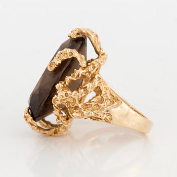 A smoky quartz cocktail ring.