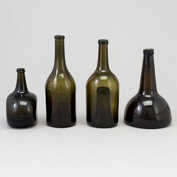 A set of four 18th/19th century hand blown glass bottles.