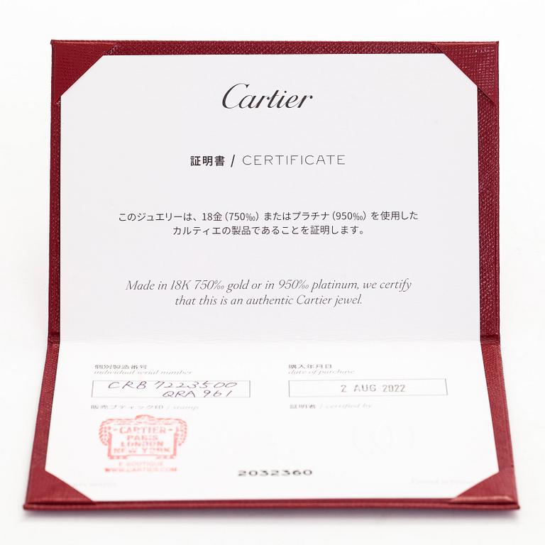 Cartier, an 18K gold 'Trinity Pendant' necklace with a brilliant-cut diamond.