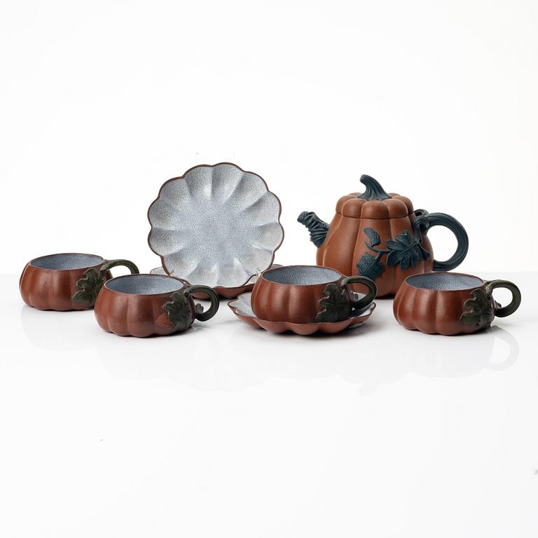 A Chinese yixing 'gourd' teapot, four cups and three saucers, 1980s.