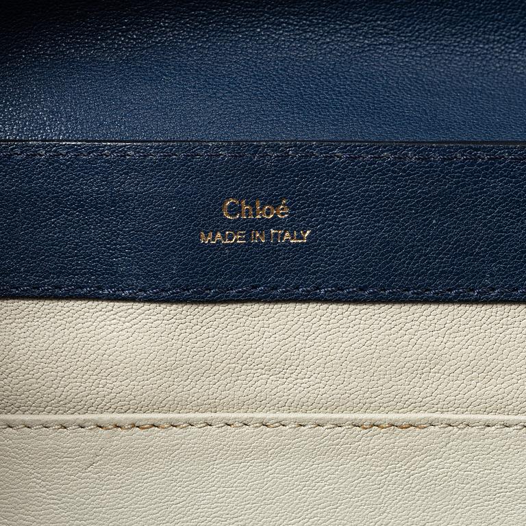 Chloé, a blue leather bag.