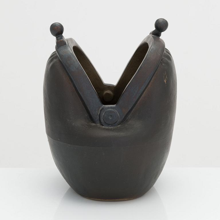 Outi Leinonen, a ceramic vase formed as a purse for Pentik, Finland.