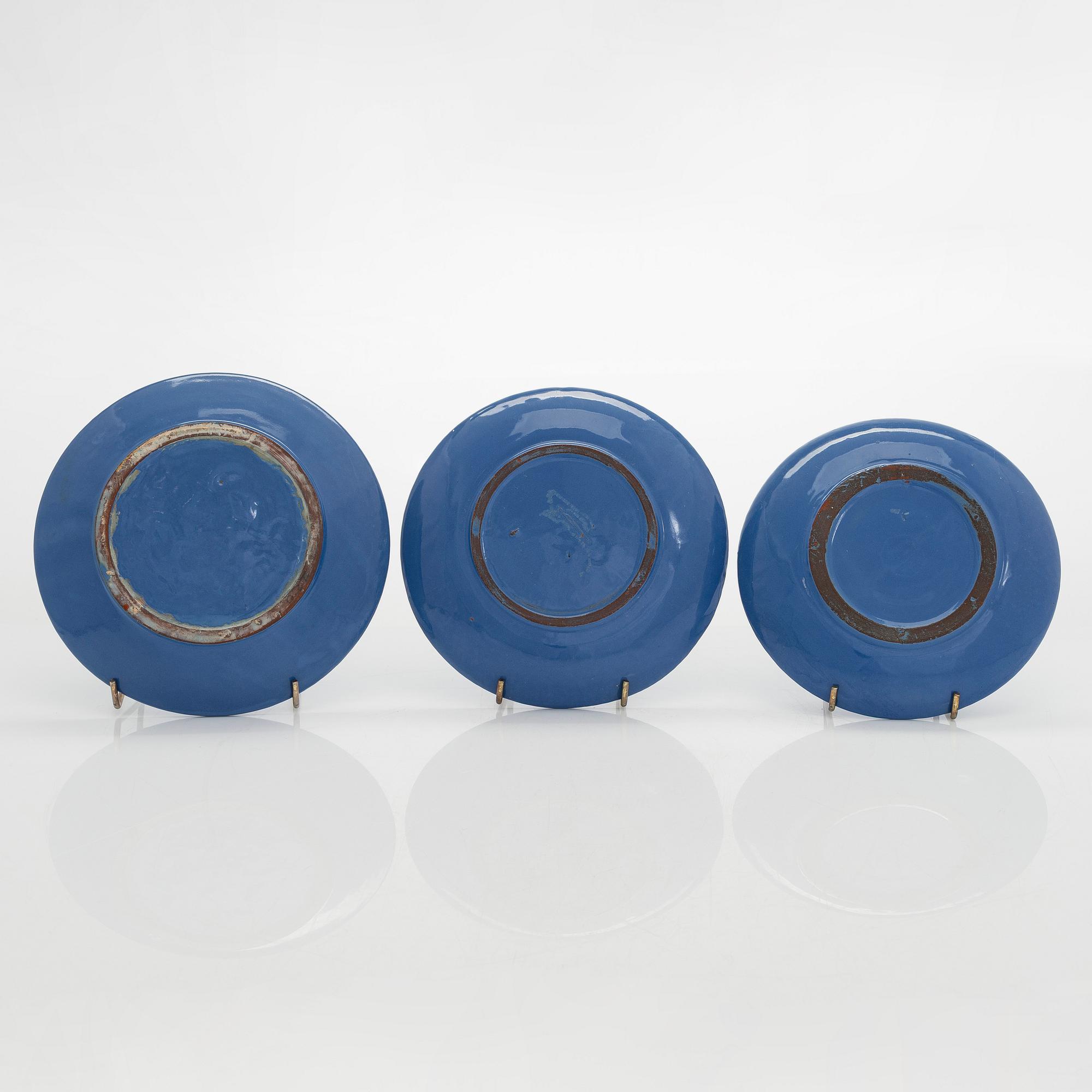 Marita Lybeck, a set of three ceramic plates and cream jug, red clay, signed ML.