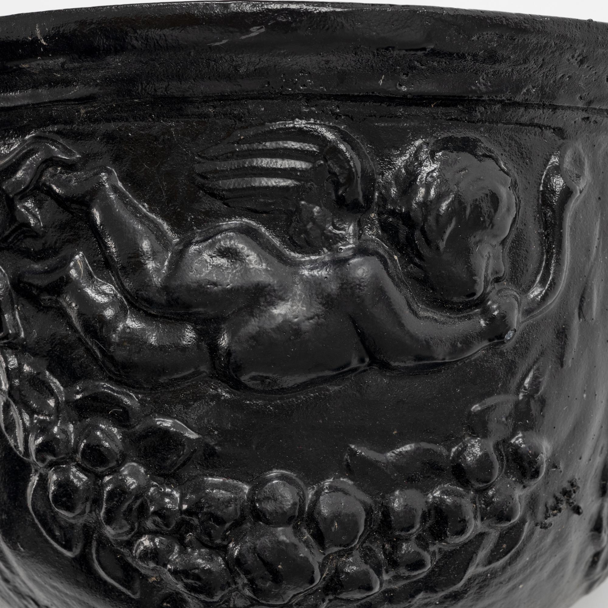 A pair of cast-iron urns.