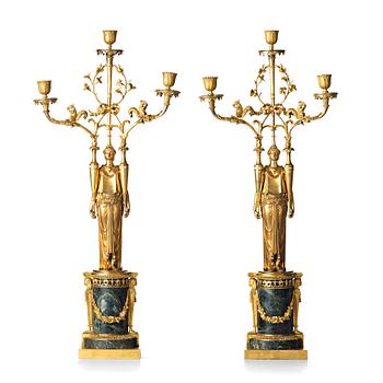 A pair of French Directoire three-light candelabra, circa 1800.