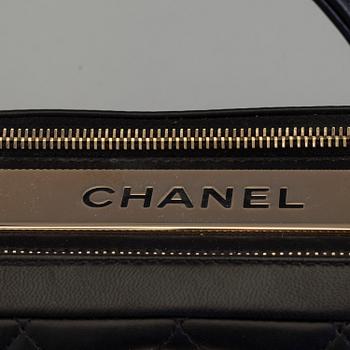 A black leather bag by Chanel 2014-2015.