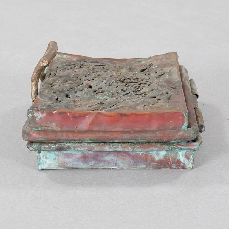 a metal sculpture, signed and dated -83.