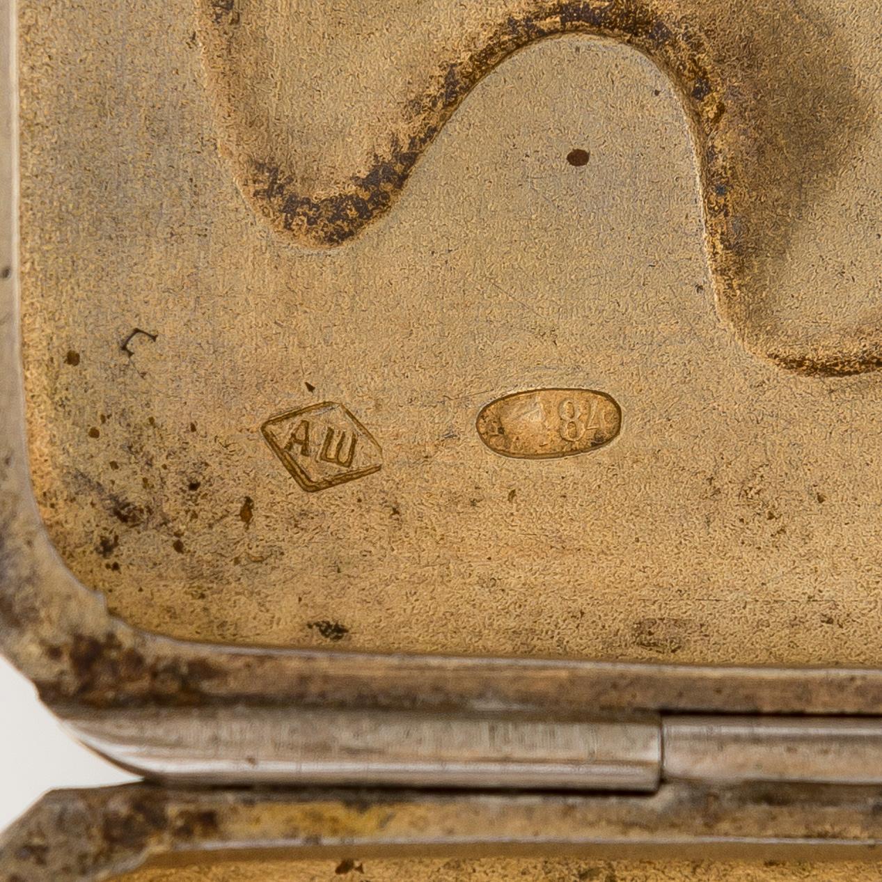 A silver cigarette case, Moscow, dated 1916.