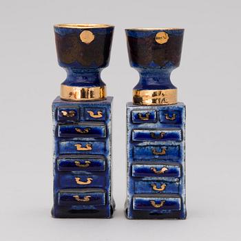 A pair of ceramic candlesticks signed Kaipiainen.