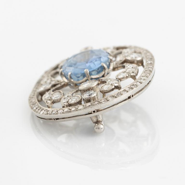 A WA Bolin brooch in platinum set with a faceted sapphire and old- and eight-cut diamonds.